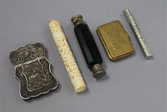 A scent bottle, a pen, a calling card case and an ivory case